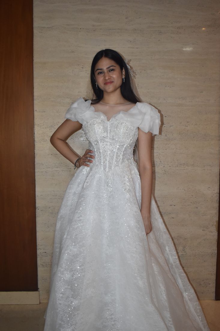 Beaded gown with organza puff sleeves and an illusion neckline
